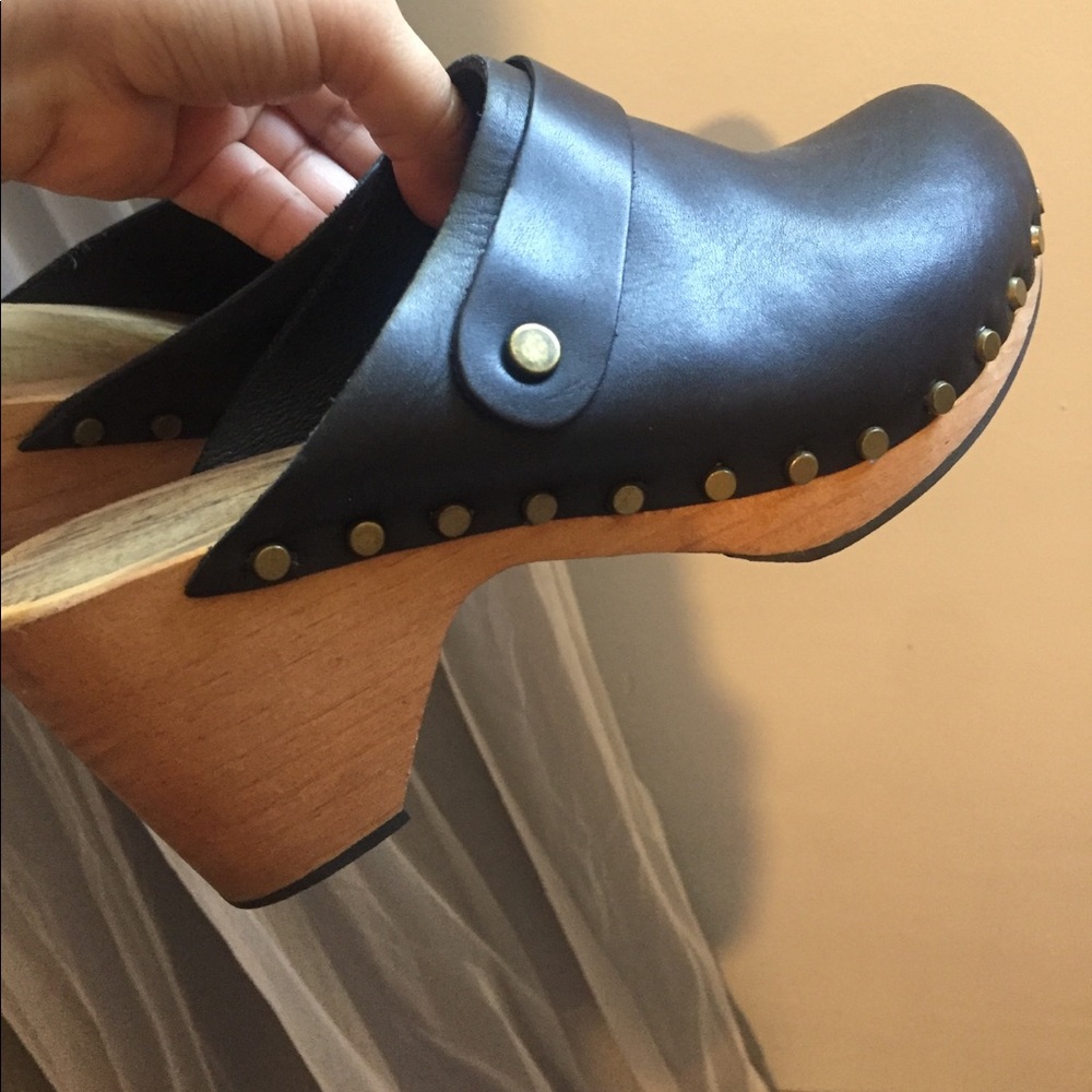Black leather clogs